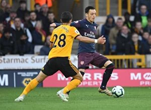 Images Dated 24th April 2019: Mesut Ozil Faces Pressure: Wolverhampton Wanderers vs. Arsenal FC, Premier League 2018-19