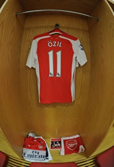 Arsenal V Tottenham Hotspur 2014-15 Prints: Mesut Ozil: Gearing Up for Battle - Arsenal Changeroom, 2014-15 Premier League