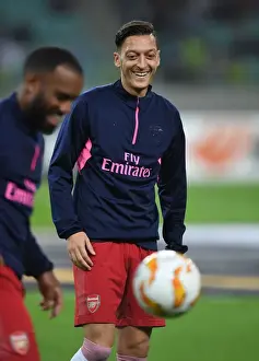 Qarabag V Arsenal 2018-19 Prints: Mesut Ozil Gears Up: Arsenal's Star Player Readies for Qarabag Showdown in Europa League