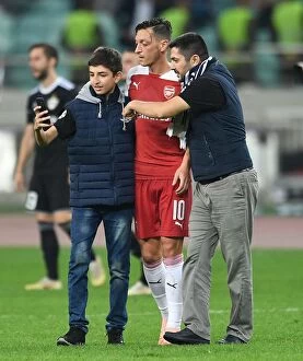 Images Dated 4th October 2018: Mesut Ozil Interacts with Fans after Arsenal's UEFA Europa League Match against Qarabag FK