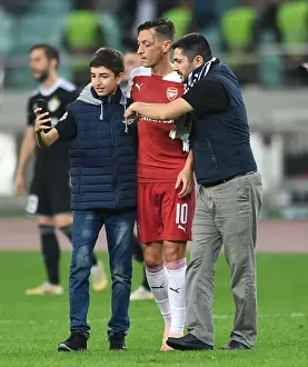 Mesut Ozil Interacts with Fans after Arsenal's UEFA Europa League Match against Qarabag FK
