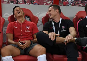 Arsenal V PSG Pre Season Friendly 2018-19 Prints: Mesut Ozil and Julian Draxler Share a Moment Before Arsenal vs