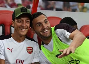 Arsenal v Atletico Madrid 2018-19 Collection: Mesut Ozil and Lucas Perez: Arsenal Stars Prepare for Atletico Madrid Clash in 2018 International