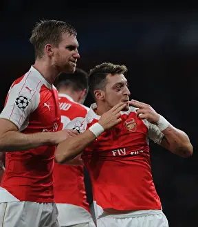 Arsenal V Bayern Munich 2015/16 Prints: Mesut Ozil and Per Mertesacker: Arsenal's Unforgettable Goal Celebration vs Bayern Munich