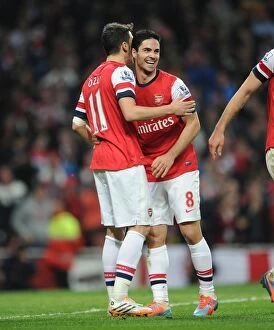 Images Dated 28th April 2014: Mesut Ozil and Mikel Arteta Celebrate Arsenal's Victory: Arsenal v Newcastle United