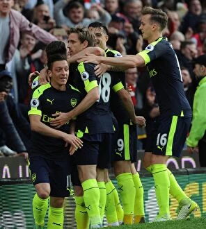 Images Dated 13th May 2017: Mesut Ozil, Monreal, Xhaka, and Holding Celebrate Arsenal's Goals Against Stoke City