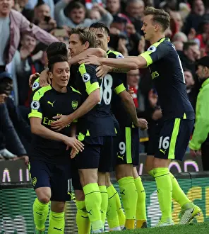 Mesut Ozil, Monreal, Xhaka, and Holding Celebrate Arsenal's Goals Against Stoke City