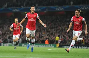 Arsenal V Napoli 2013-14 Prints: Mesut Ozil and Olivier Giroud Celebrate Arsenal's First Goal Against Napoli in the 2013-14 UEFA Champions League