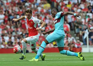 Arsenal V West Ham United 2015-16 Prints: Mesut Ozil Outmaneuvers Diafra Sakho: Arsenal vs West Ham United, Premier League 2015-16
