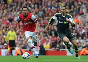 Arsenal V Stoke City 2013-14 Prints: Mesut Ozil Outmaneuvers Geoff Cameron: Arsenal vs Stoke City, Premier League 2013-14
