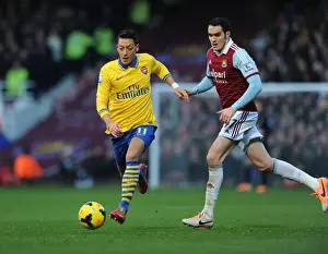West Ham United V Arsenal 2013-14 Prints: Mesut Ozil Outmaneuvers Joey O'Brien: A Pivotal Moment in the West Ham United vs