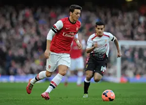 Arsenal V Liverpool - FA Cup 2013-14 Prints: Mesut Ozil Outmaneuvers Philippe Coutinho: Arsenal vs Liverpool, FA Cup 2013-14