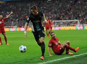 Bayern Munich V Arsenal 2015-16 Prints: Mesut Ozil Outmaneuvers Phillip Lahm: A UEFA Champions League Showdown