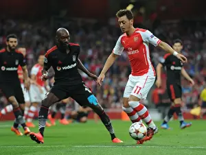 Arsenal V Besiktas 2014/15 Prints: Mesut Ozil Outsmarts Atiba Hutchinson: Arsenal's UEFA Champions League Victory