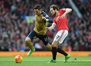 Manchester United V Arsenal 2015/16 Prints: Mesut Ozil Outsmarts Daley Blind: Premier League Clash between Arsenal and Manchester United (2015/16)