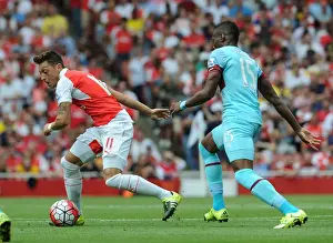 Arsenal V West Ham United 2015-16 Prints: Mesut Ozil Outsmarts Diafra Sakho: Arsenal vs West Ham United, Premier League 2015-16