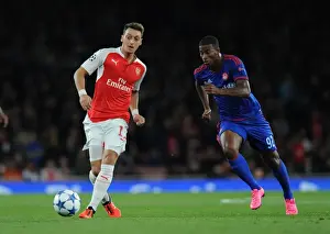 Arsenal V Olympiacos 2015/16 Prints: Mesut Ozil Outsmarts Felipe Pardo: Arsenal vs Olympiacos, 2015/16 UEFA Champions League