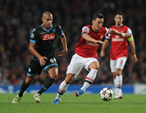 Arsenal V Napoli 2013-14 Prints: Mesut Ozil Outsmarts Gokhan Inler: Arsenal vs. Napoli, UEFA Champions League, 2013