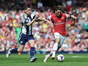 Arsenal v West Bromwich Albion 2013-14 Collection: Mesut Ozil Outsmarts Graham Dorrans: Arsenal's Masterclass vs