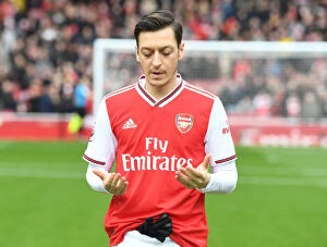 Arsenal v West Ham United 2019-20 Collection: Mesut Ozil in Prayer: Arsenal Football Club's Pre-Match Focus before Arsenal vs West Ham
