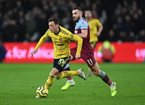 West Ham United V Arsenal 2019-20 Prints: Mesut Ozil Under Pressure: West Ham vs