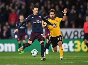 Wolverhampton Wanderers V Arsenal 2018-19 Prints: Mesut Ozil Under Pressure: Wolverhampton Wanderers vs