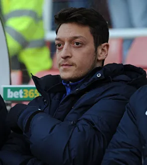 Stoke City V Arsenal 2013-14 Prints: Mesut Ozil: Ready to Sub in for Arsenal against Stoke City (2013-14)