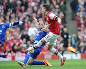 Arsenal V Everton - FA Cup 2014 Prints: Mesut Ozil score Arsenals 1st goal past Seamus Coleman (Everton). Arsenal 4: 1 Everton