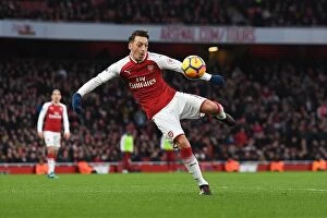 Images Dated 16th December 2017: Mesut Ozil Scores: Arsenal's Triumph Over Newcastle United, Premier League 2017-18