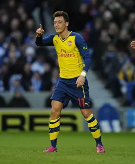 Brighton And Hove Albion V Arsenal - FA Cup 2014/15 Prints: Mesut Ozil Scores Brace: Arsenal Triumphs Over Brighton in FA Cup