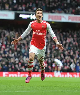 Arsenal V Aston Villa 2014-15 Prints: Mesut Ozil Scores the Decisive Goal: Arsenal's Triumph over Aston Villa