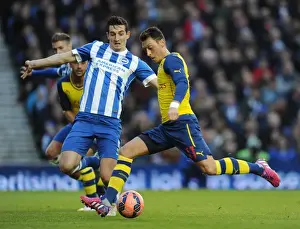 Brighton And Hove Albion V Arsenal - FA Cup 2014/15 Prints: Mesut Ozil Scores Dramatic Goal Past Lewis Dunk in FA Cup Clash between Brighton & Arsenal