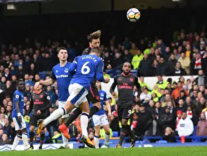 Mesut Ozil Scores Under Pressure: A Intense Moment from Everton vs Arsenal, Premier League 2017-18 - Ozil's Goal Amidst Jagielka's Challenge