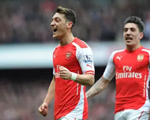 Mesut Ozil Scores the Second Goal: Arsenal's Victory Against Liverpool in the Premier League 2014-15