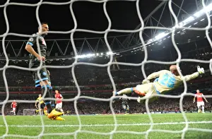 Arsenal V Napoli 2013-14 Prints: Mesut Ozil Scores Stunner Past Pepe Reina in Arsenal's UEFA Champions League Victory over Napoli (2013-14)