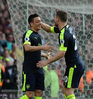 Stoke City V Arsenal 2016-17 Prints: Mesut Ozil and Shkodran Mustafi Celebrate Arsenal's Second Goal Against Stoke City