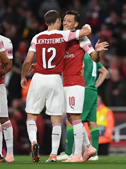 Arsenal V FC Vorskla Poltava 2018_19 Prints: Mesut Ozil and Stephan Lichtsteiner Celebrate Arsenal's Goals Against Vorskla Poltava in Europa League