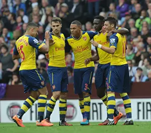 Aston Villa V Arsenal 2014-15 Prints: Mesut Ozil and Team Celebrate First Goal Against Aston Villa (2014-15)