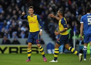 Images Dated 25th January 2015: Mesut Ozil and Theo Walcott Celebrate Arsenal's FA Cup Goals Against Brighton & Hove Albion