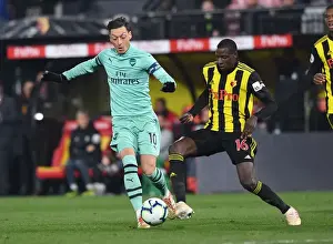 Mesut Ozil vs Abdoulaye Doucoure: A Premier League Showdown at Vicarage Road