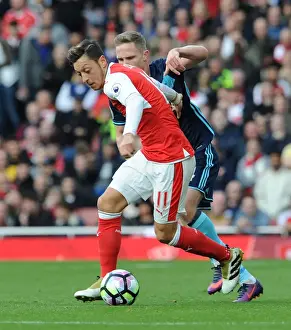 Arsenal V Middlesbrough 2016-17 Prints: Mesut Ozil vs. Adam Forshaw: A Premier League Showdown at Emirates Stadium (2016-17)