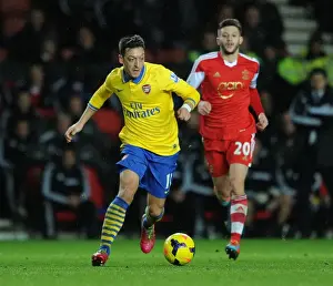 Southampton V Arsenal 2013-14 Prints: Mesut Ozil vs. Adam Lalana: Battle in the Premier League - Southampton vs