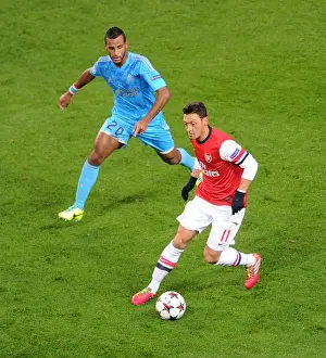 Mesut Ozil vs Alaixys Romao: Intense Battle at Arsenal v Marseille, UEFA Champions League (2013-14)