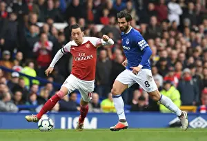Mesut Ozil vs. Andre Gomes: Intense Battle at Goodison Park during Arsenal's Premier League Clash with Everton