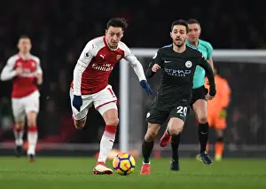 Arsenal V Manchester City 2017-18 Prints: Mesut Ozil vs Bernardo Silva: A Premier League Battle at Arsenal's Emirates Stadium