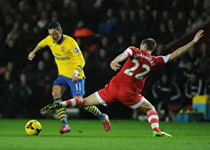 Southampton V Arsenal 2013-14 Prints: Mesut Ozil vs Calum Chambers: Intense Battle at Southampton's St Marys Stadium (Arsenal vs Southampton)