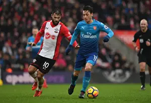 Southampton V Arsenal 2017-18 Prints: Mesut Ozil vs Charlie Austin: Intense Battle in Southampton v Arsenal