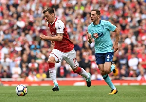 Arsenal V AFC Bournemouth 2017-18 Prints: Mesut Ozil vs. Dan Gosling: Arsenal vs. AFC Bournemouth, Premier League Showdown (2017-18)