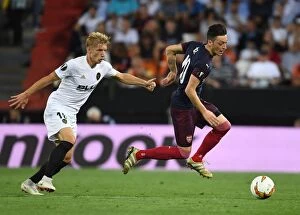 Images Dated 9th May 2019: Mesut Ozil vs. Daniel Wass: A Europa League Semi-Final Battle at Valencia