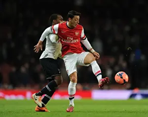 Arsenal V Tottenham Hotspur 2013-14 Prints: Mesut Ozil vs. Danny Rose: Intense Battle at the Emirates - Arsenal vs